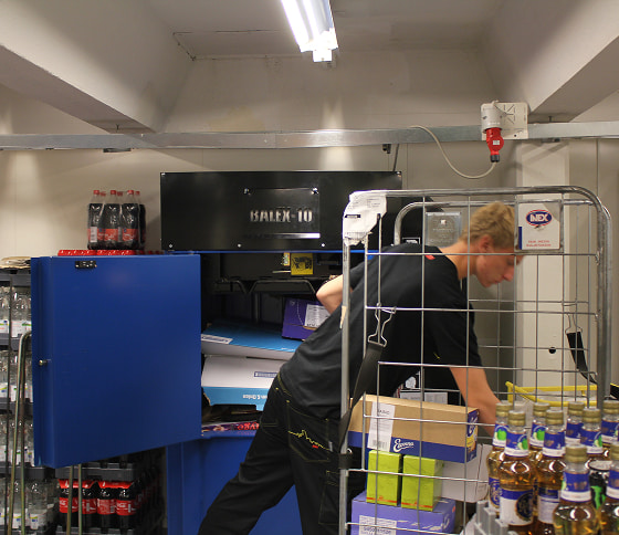 Kenburn Balex 10 waste baler in storeroom of a retail supermarket.