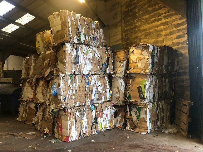 500 kg cardboard bales produced by the Kenburn horizontal baling machine.